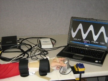 Experimental setup with sensors and laptop computer